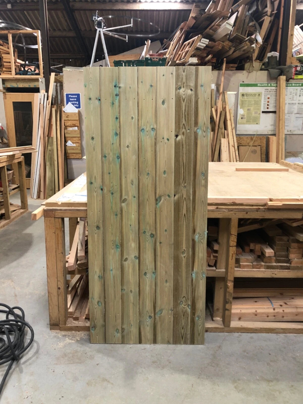Stack of wooden planks in a workshop setting