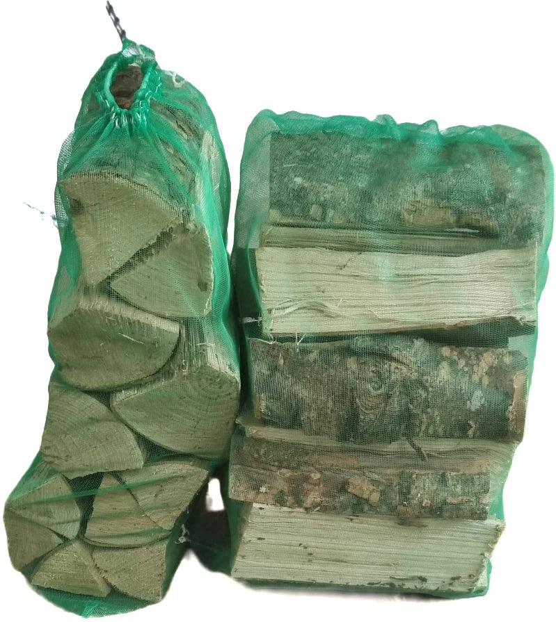 Stack of firewood with a green bag on a white background