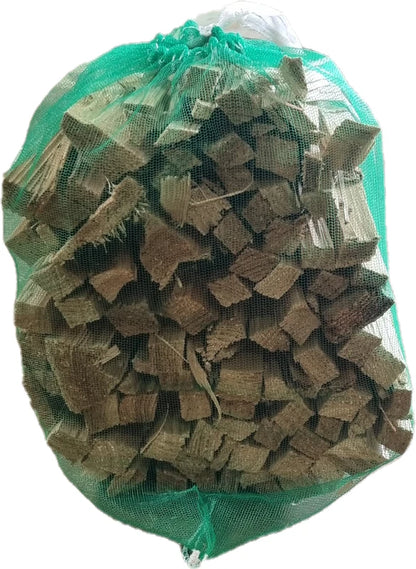 Bag of brown wooden blocks with a green mesh bag on a white background